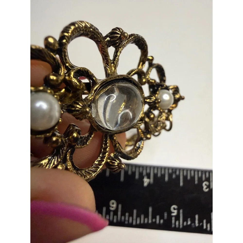 Ornate Gold Tone Filigree Brooch Faux Pearls Clear Cabochon and Triple Chain